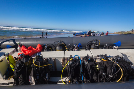 Scuba Dive boat beached with oxygen bottles rigs secured to consoles before vessels launch with client scuba diversのeditorial素材