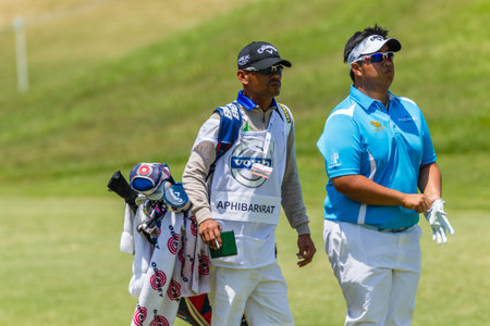 Professional Kiradech Aphibarnrat and Caddy at the European pga Volvo Golf Champions tournament at...