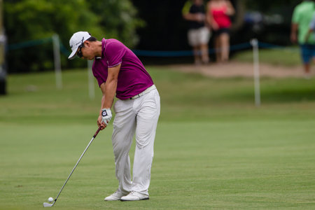 Professional Jin Jeong swings and strikes his ball at the European pga Volvo Golf Champions tournament at Durban Country club South Africaのeditorial素材