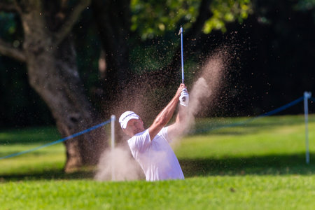 Professional Richard Sterne swings and strikes his ball at the European pga Volvo Golf Champions tournament at Durban Country club South Africaのeditorial素材