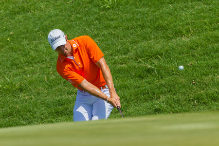 Professional Golfer Julien Quesne chips to strike ball at European PGA Tournament Volvo Golf...