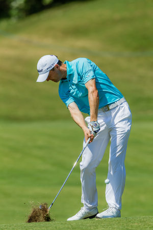 Professional Golfer Michael Hoey swings to strike ball at European PGA Tournament Volvo Golf Champions Tournament play action at Durban Country Club  January 2014 South Africaのeditorial素材