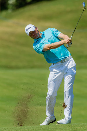 Professional Golfer Michael Hoey swings to strike ball at European PGA Tournament Volvo Golf Champions Tournament play action at Durban Country Club  January 2014 South Africaのeditorial素材