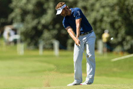 Professional Golfer Raphael Jacquelin swings to strike ball at European PGA Tournament Volvo Golf Champions Tournament play action at Durban Country Club  January 2014 South Africaのeditorial素材