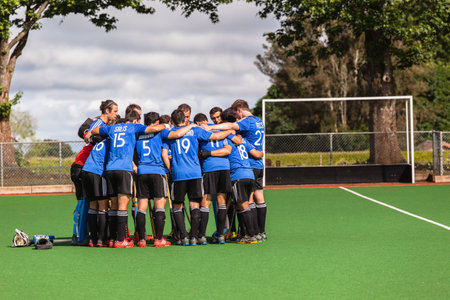 Argentina hockey team talk before game starting on astro turf field