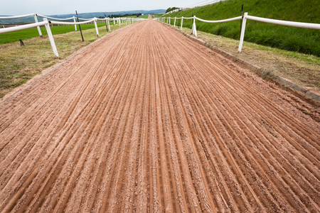 Horse racing training sand track with smooth grooved    soil detail ready for running の写真素材