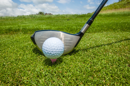 Golf Driver club with ball set on plastic teeの写真素材
