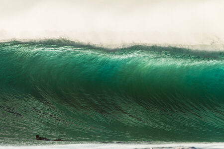 Surfing large cyclone summer waves at Durban s new pier beach surf cityの写真素材