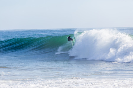 Surfing large cyclone summer waves Jordy Smith at Durban s north beach surf city の写真素材