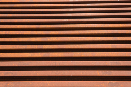 Steel Railway manufactured new track lines stacked close together ready to install and maintenance engineering repairs   Abstract angles photo of metal linesの写真素材