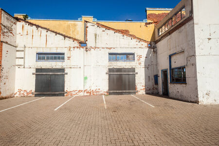 Condemned Building shell walls about to be demolished with no roofing abandoned dangerous walls standing with no support structuresの写真素材