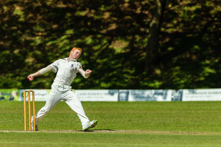 Cricket Bowler bowling at speed towards batsman during game Westville plays Durban Boys High School 1st Teams derbyのeditorial素材
