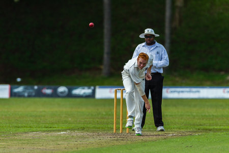 Cricket Bowler bowling at speed towards batsman during game Westville plays Durban Boys High School 1st Teams derbyのeditorial素材
