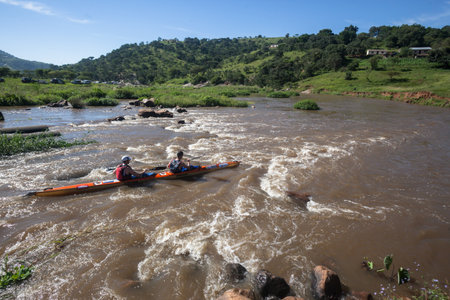 Dusi canoe race action at Mission Rapids with paddlers going through rushing river watersのeditorial素材