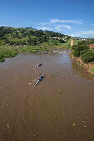 Dusi canoe race action at Mission Rapids with paddlers going through rushing river watersのeditorial素材
