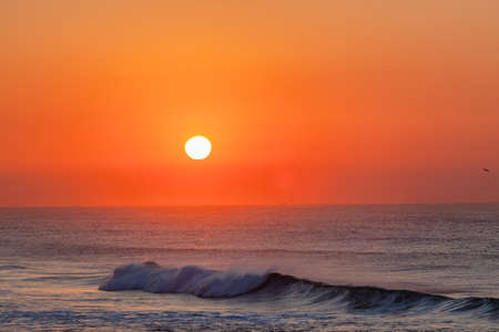 Sunrise ocean waves horizon colors of natureの写真素材