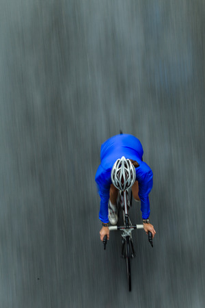 Cycling race woman rider birds eye view overlooking in color speed blur in raceの写真素材