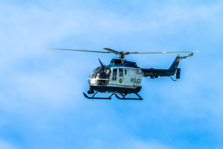 Helicopter aircraft police force flying in blue skyのeditorial素材