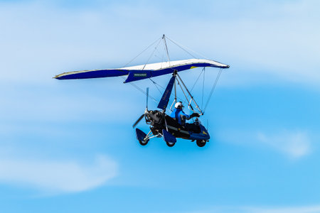 Microlight Aircraft pilot flying blue skyのeditorial素材