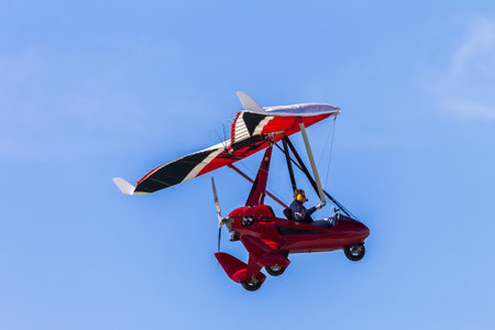 Microlight Aircraft pilot flying blue skyのeditorial素材