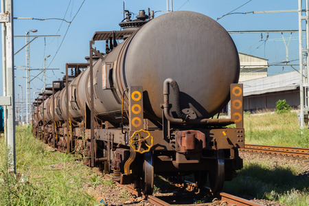 Train tanker trailers on rail line linked togetherの写真素材