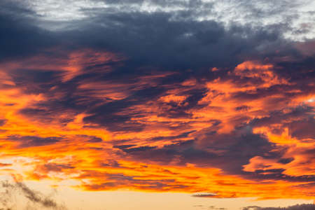 Sun rays reflections of color on clouds late afternoon の写真素材
