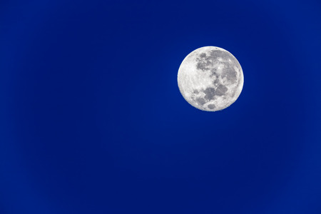 Full moon in blue skyの写真素材