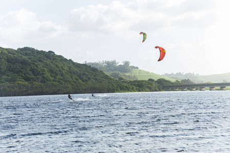 Kite surfing in lagoon surf action beach river lagoon north of Durban South Africaの写真素材