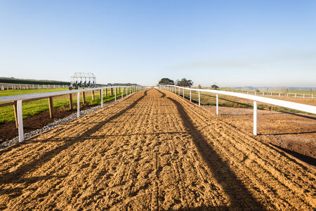 Horse racing training track sand in afternoon colorの写真素材