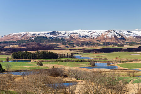 Scenic  mountain farming landscape  terrain in color contrasts of seasons in natureの写真素材