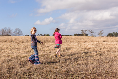 Young girls walking exploring in rural countryside nature reserveの写真素材