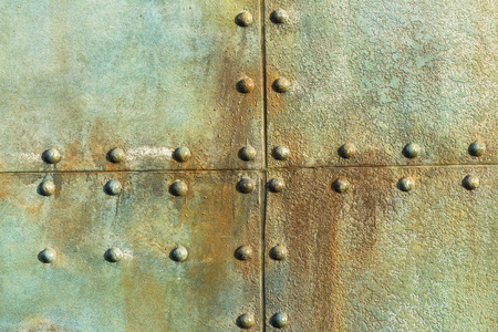 Old ship deck metal plate rivets detail background decor of era in ocean transport.