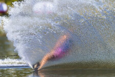 Water skiing girl slalom action hard turn actionの写真素材