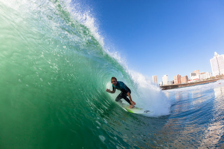 Surfer surfing  water action Durban beachfront