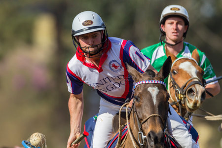 PoloCrosse Ireland v United-Kingdom Player riders action play at world cup polo-cross championship games at Shongweni equestrain fields outside Durban.のeditorial素材
