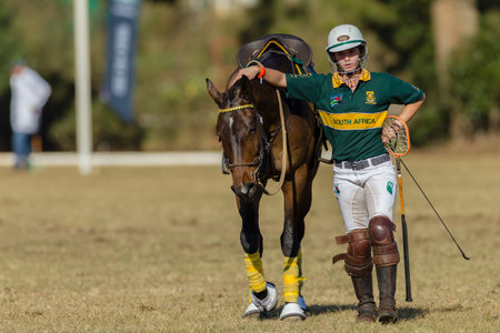 South-Africa v Zambia Player riders action play at world cup polo-cross championship games at Shongweni equestrain fields outside Durban.のeditorial素材