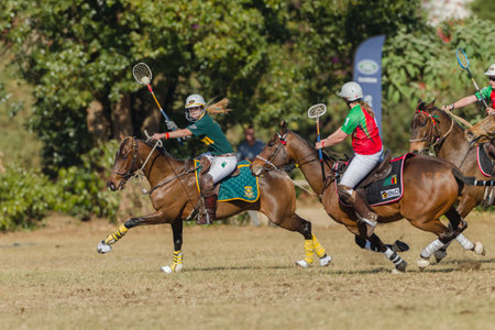 Polocrosse sport world-cup South Africa Natalie McLarty play action at Shongweni equestrian fieldsのeditorial素材