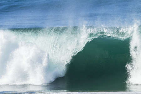 Ocean wave hollow crashing water power of nature.