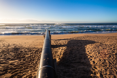 Storm Water drain pipe onto beach coastline for floodingの写真素材