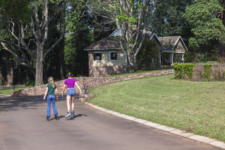 Girls home driveway skating holidays holidays fun.の写真素材