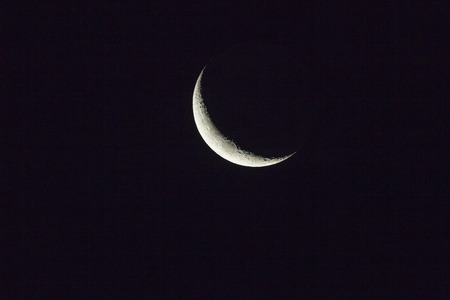 New Moon sunlight on side of planetの写真素材