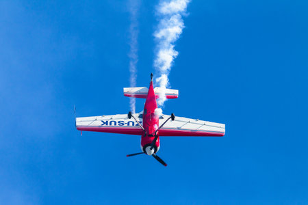 Aircraft acrobatic plane pilot in flying action.