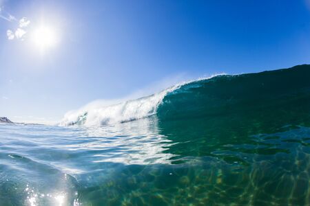 Wave inside hollow crashing blue ocean water swimming photoの写真素材