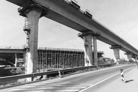 Construction new traffic road highway intersection junction flyover ramps of concrete steel design.の写真素材
