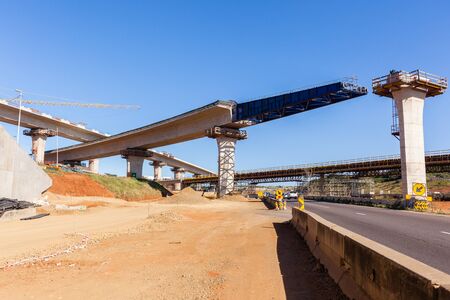Construction new traffic road highway intersection junction flyover ramps of concrete steel design.の写真素材