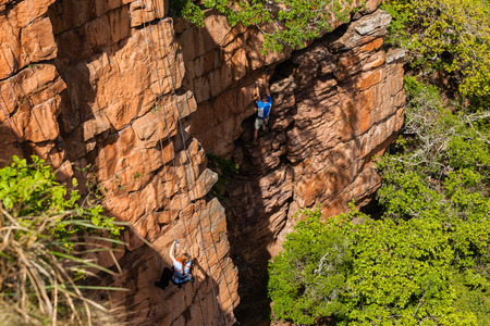 Rock cliff climber woman countryside sportの写真素材