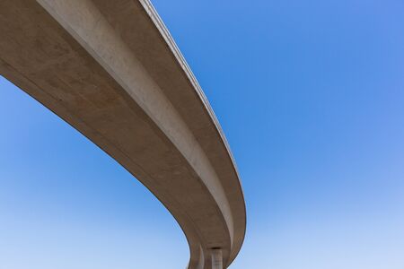 New highway road junction overhead ramp exit, entry for traffic vehicle flow.