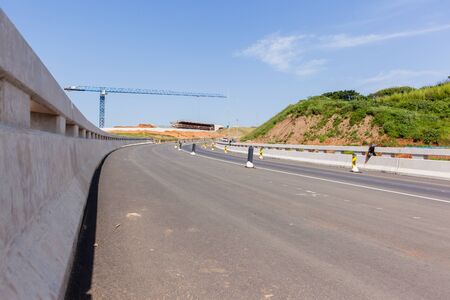 New highway roads junction construction ramps,exits, entry for traffic vehicle flow.