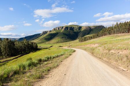 Rural dirt road along scenic mountain landscape