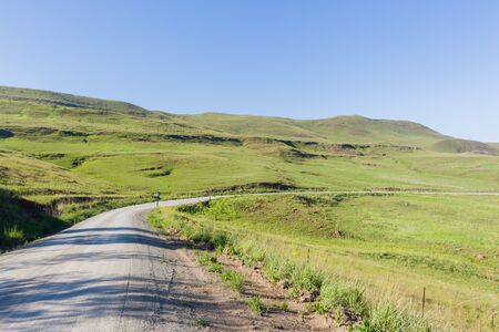 Dirt road route through scenic rural mountain terrain.の写真素材